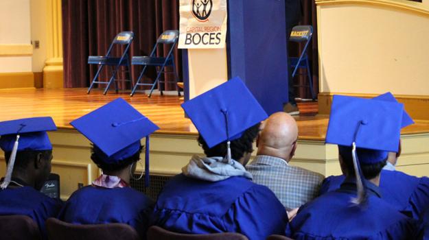 graduates looking up to stage