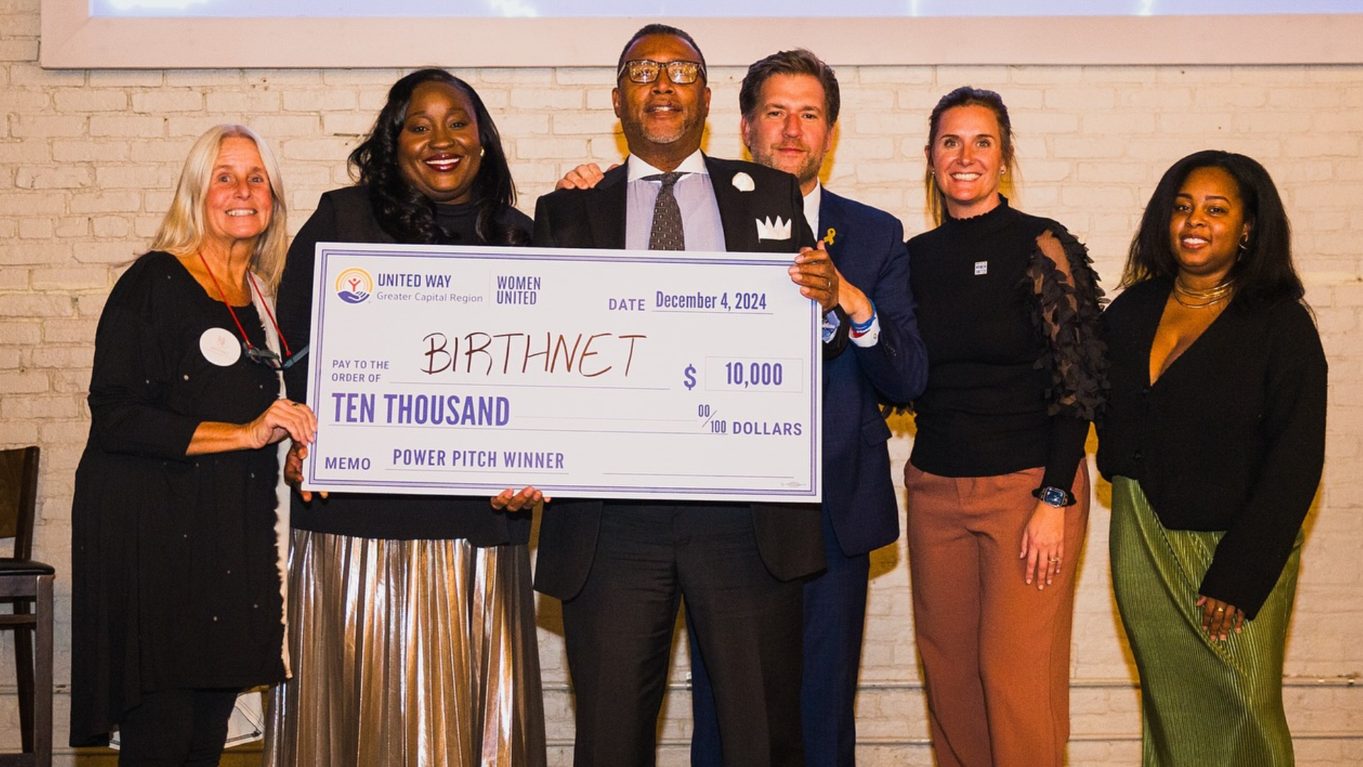 BirthNet holding winning Power Pitch Check